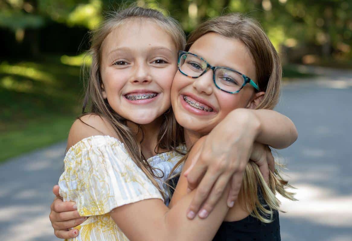 Teen-girls-happy-braces-smiling-outside-orthodontic-treatment Orthodontics